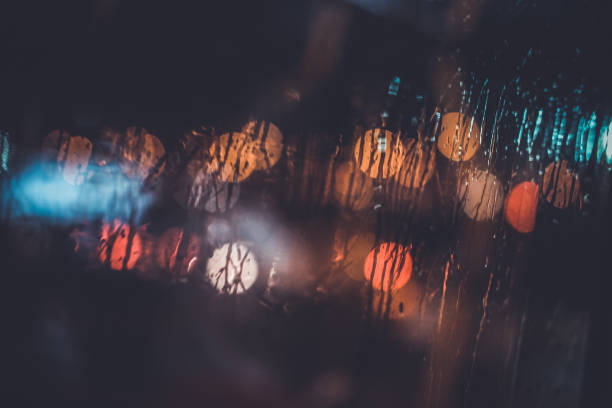 istock Traffic lights through the window in a rainy night 1177924475