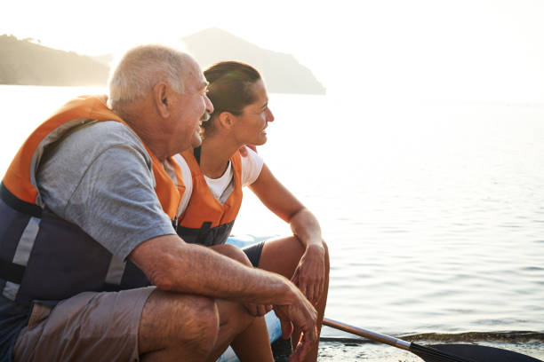 istock Smiling father and daughter looking at river 1177929348
