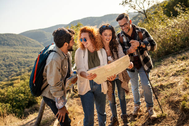 istock Friends looking at map on hiking 1177930340