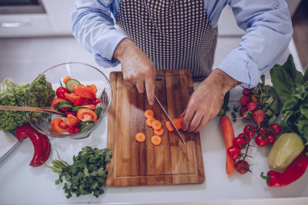 istock An older chef prepares a vegetarian lunch 1177930384