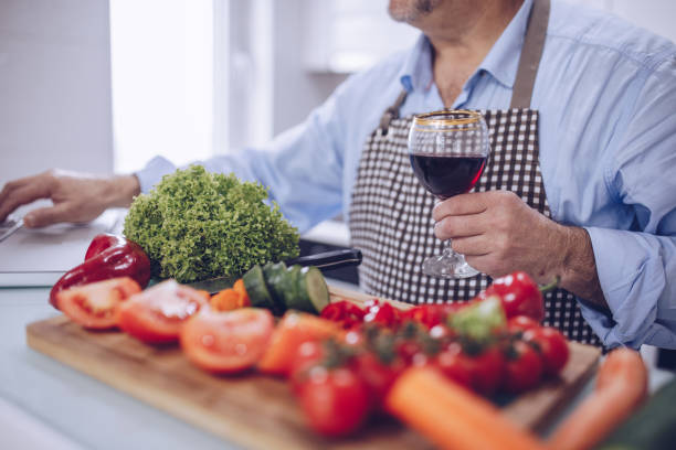istock An older chef prepares a vegetarian lunch 1177930394
