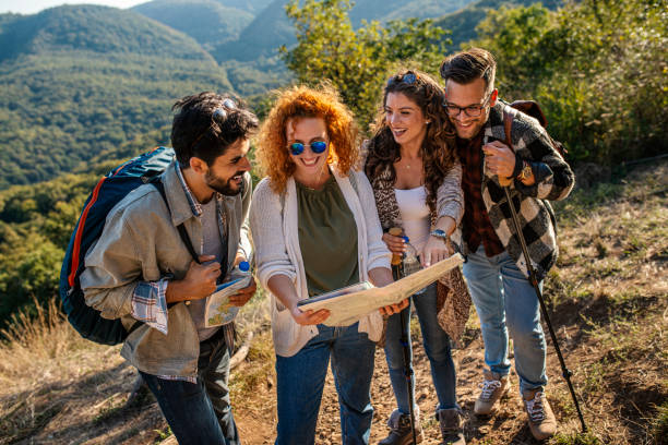 istock Friends looking at map on hiking 1177930412