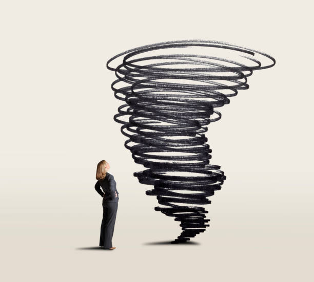 istock Businessman Looking Up At Swirling Tornado 1177930418