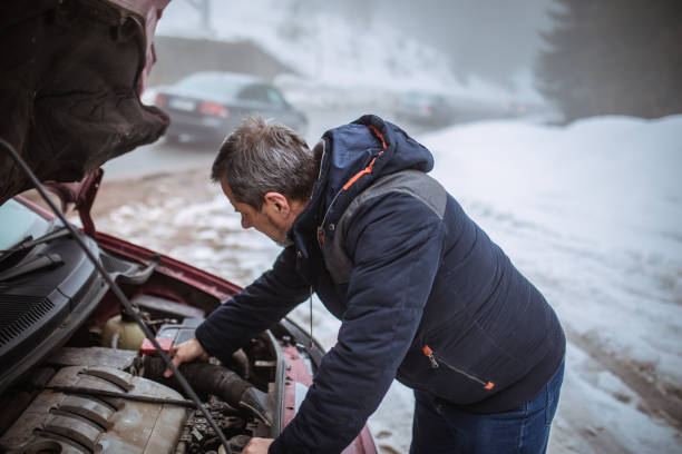 istock An older man has a car breakdown, winter weather 1177932231