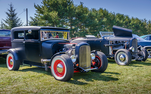 Hilden, Nova Scotia, Canada - September 21, 2019 : A pair of traditional styled hot rods, 1929 Ford Model A sedan & 1932 Ford Deuce roadster at Scotia Pine Show & Shine, Scotia Pine Campground.