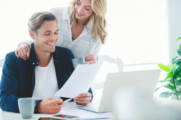 istock Young Couple working on their home finances and other paperwork. 1177934299