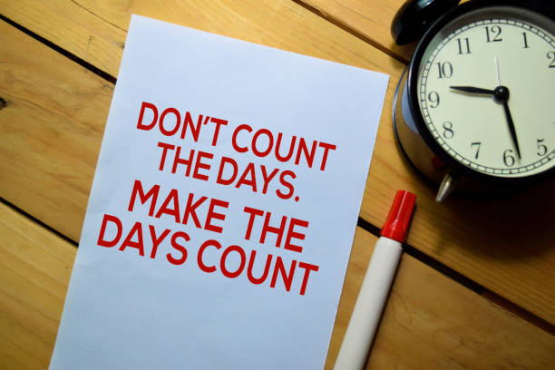 istock Don't Count The Days. Make The Days Count text on the paper isolated on table background 1177937320