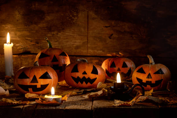 istock Halloween pumpkins head jack o lantern on wooden table background 1177941764
