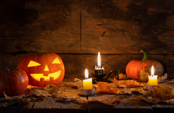 istock Halloween pumpkins head jack o lantern on wooden table background 1177941765