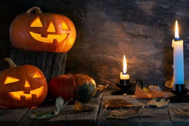 istock Halloween pumpkins head jack o lantern on wooden table background 1177941779