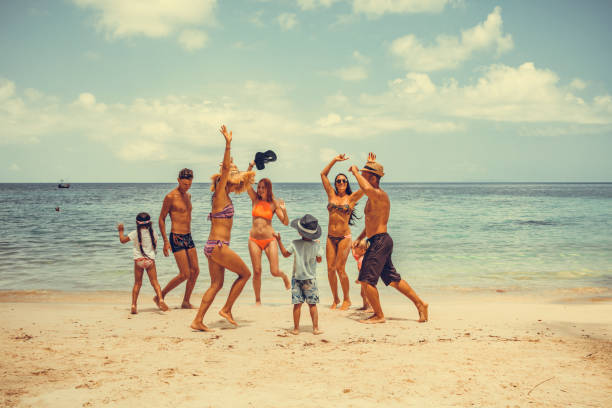 istock friends dancing on the beach 1177942812