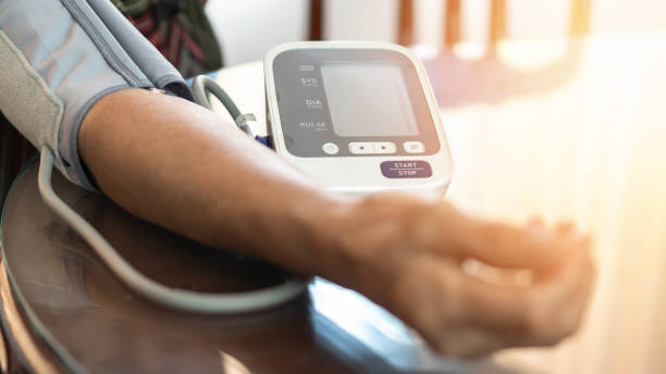 elderly patient with bp, heart rate, digital pulse check equipment for medical geriatric awareness in stroke systolic high blood pressure, hypertension, hypotension and cardiovascular disease in aged senior older woman person - high up imagens e fotografias de stock