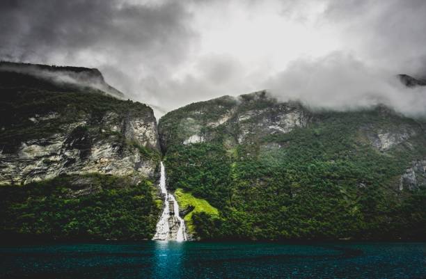 istock waterfall and clouds in geiranger fjord 1177948357