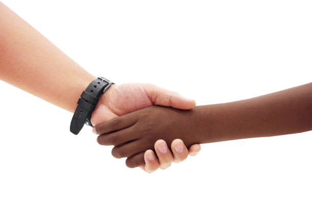 istock African and european  Hands of different races shaking 1177961582