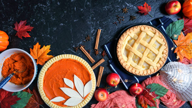 istock Thanksgiving apple and pumpkin pies on dark marble background. 1177961606