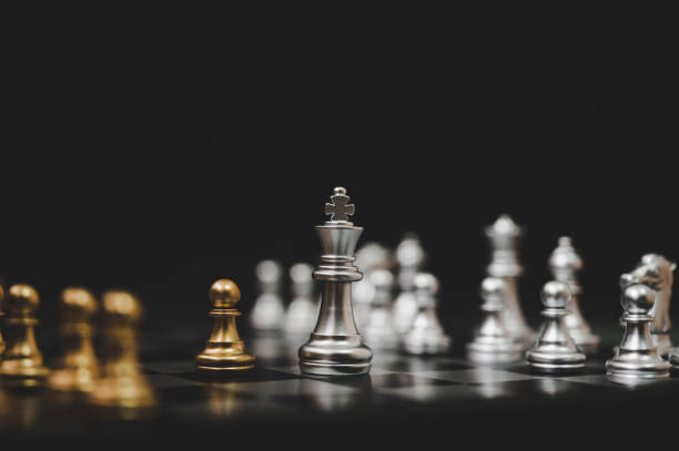 istock Business competition and strategy plan concept. Chess board game gold and silver colour 1177969632