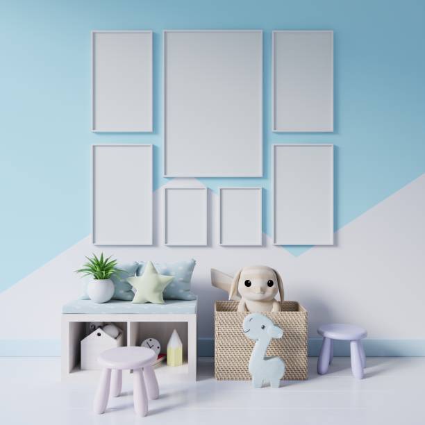 istock Mock up posters in child room interior on wall pastel colors background. 1177974637