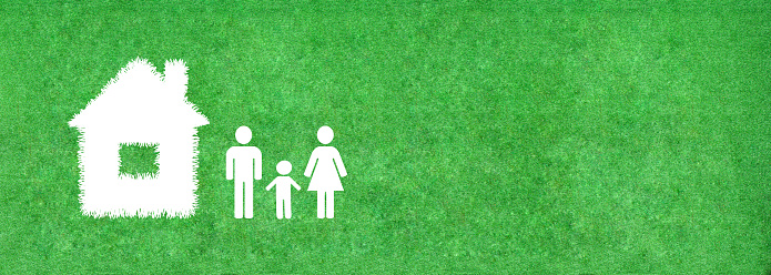 Ecology and Environmental Concept : Family and home icon on green artificial grass.