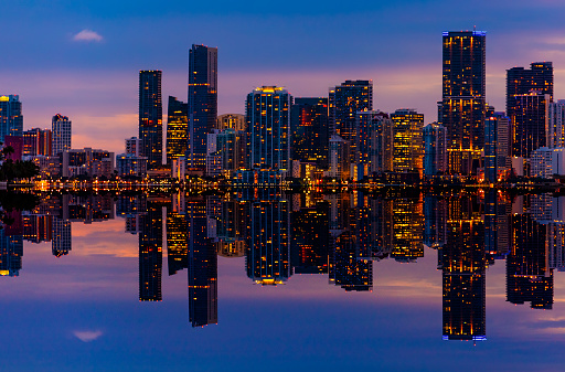 Shoreline view of Miami City Downtown district buildings at sunset