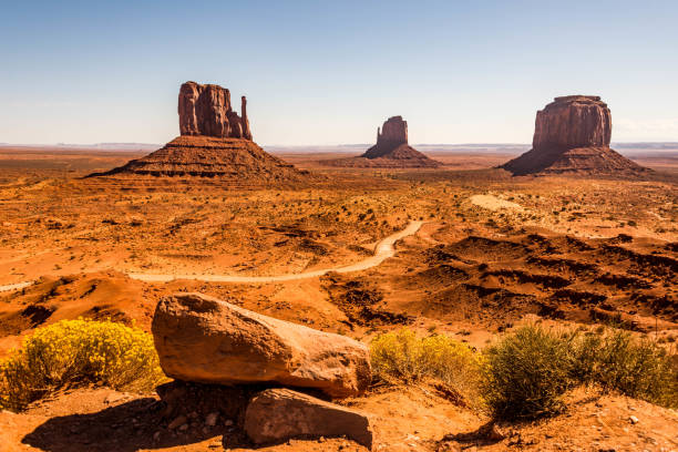 West Mitten, East Mitten and Merrick Butte in Monument Valley A view of Monument Valley with both the West and East Mittens and Merrick Butte west mitten stock pictures, royalty-free photos & images