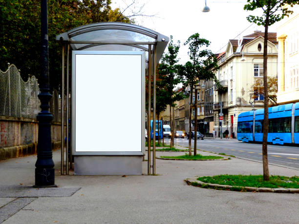 image collage of bus shelter with ad space and display glass stock photo