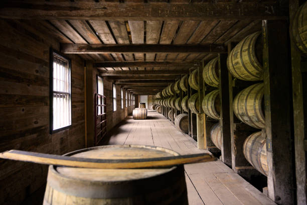 Wooden barrels room Distillery whiskey wooden barrel container room factory in Kentucky, USA bourbon whiskey photos stock pictures, royalty-free photos & images