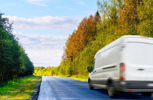 istock White van moving on the road in countryside 1177998590