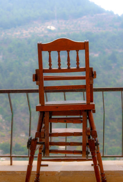 istock Wooden baby seat on a terrace 1177999899