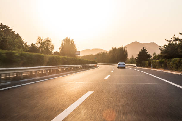 istock Sunset on straight country road 1178000635