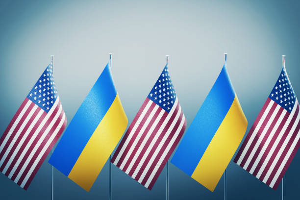 istock American and Ukrainian Flags in A Row on Grey Background 1178001849