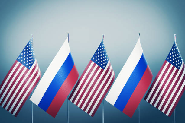 istock American and Russian Flags in A Row on Grey Background 1178001888