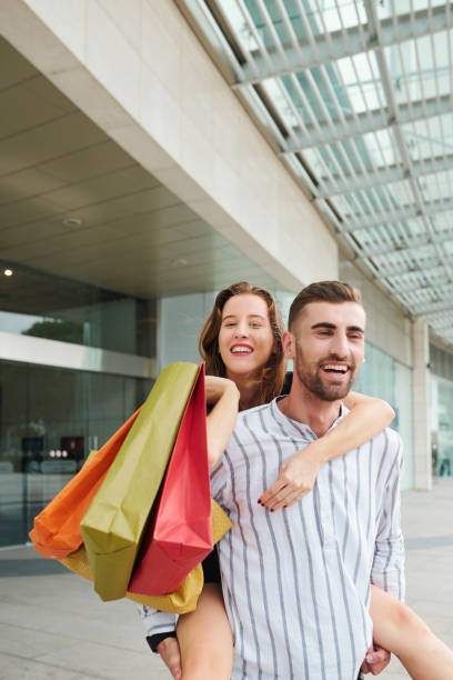 istock Happy couple having fun after shopping 1178004232