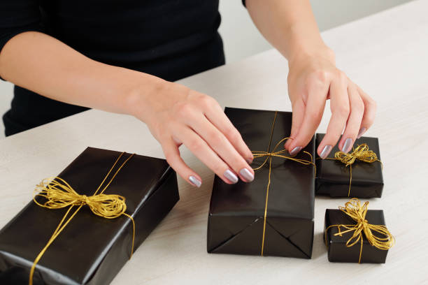 istock Woman wrapping Halloween presents 1178004691