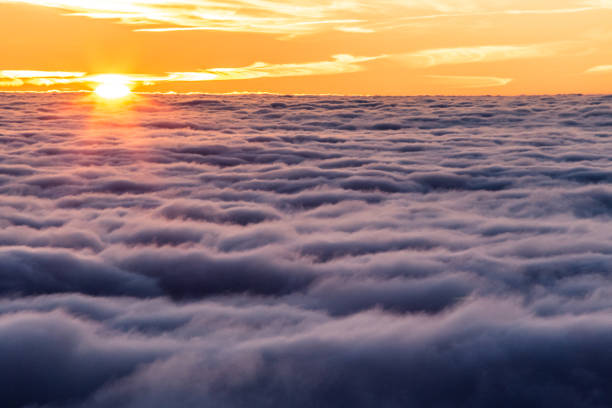 istock Beautiful sunset over a valley filled by fog 1178008205