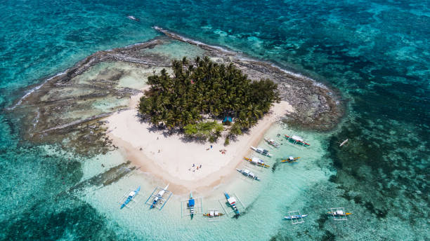 istock Small island in the Philippines with a white sand beach and palm trees 1178009774