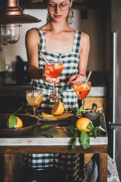 istock Young woman holding Spritz cocktail in glass 1178010631