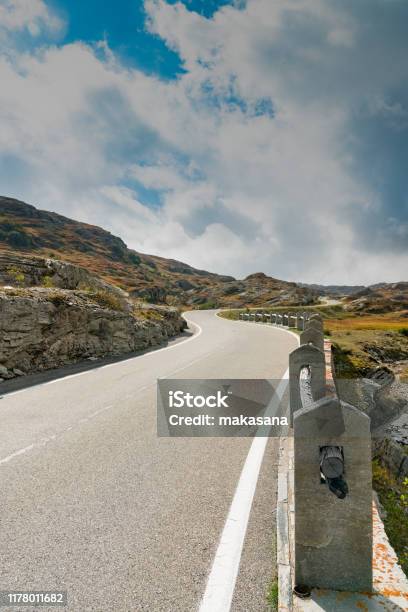 Vertical View Of A Twolane Road Leading Over A High Remote And Wild Mountain Pass In The Swiss Alps Stock Photo - Download Image Now