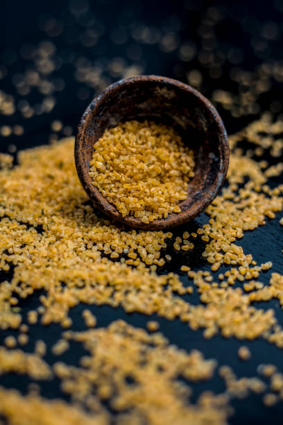 istock Raw oats in a black colored clay bowl on the black surface. 1178012895