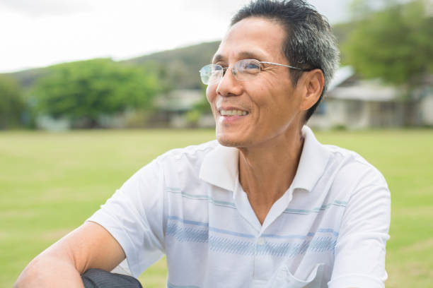 istock Happy older man sitting in the park, portrait. 1178012945