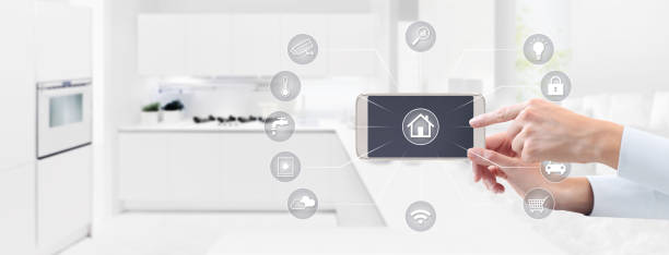 istock smart home automation control concept hand touch cell phone screen with grey symbols icons on kitchen background web banner and copy space template 1178012990