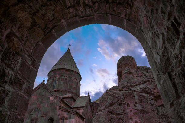 Geghard monastery in Armenia. Evening view through the arch of the monastery. Geghardavank or Geghard monastery is an Orthodox Christian monastery located in Kotayk Province of Armenia