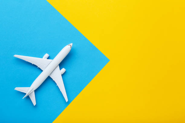 istock Airplane model on colorful paper background 1178014584