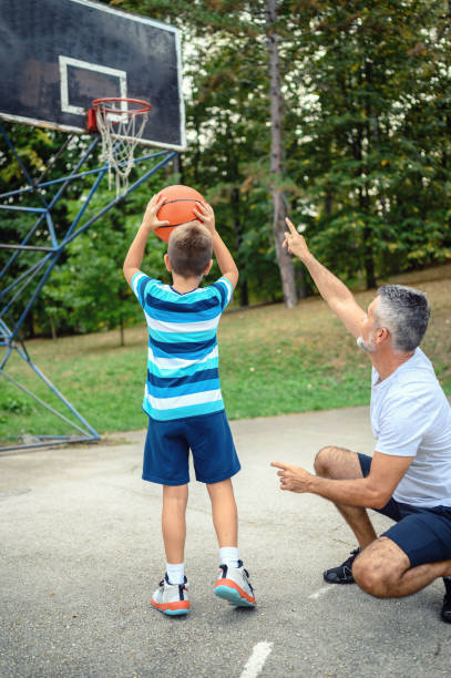 istock Father and son playing basketball 1178014596
