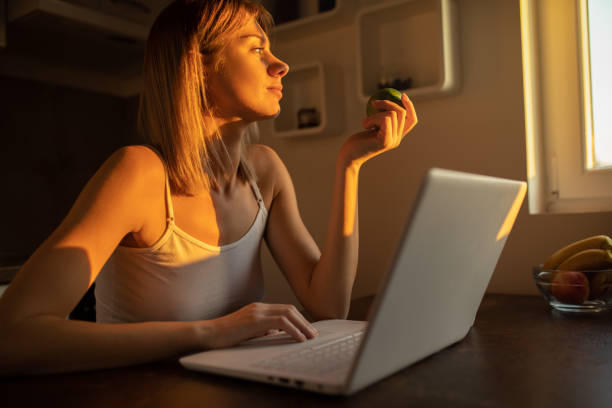 istock Young woman working on laptop at home 1178017733