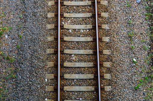 Top view of railroad tracks on gravel