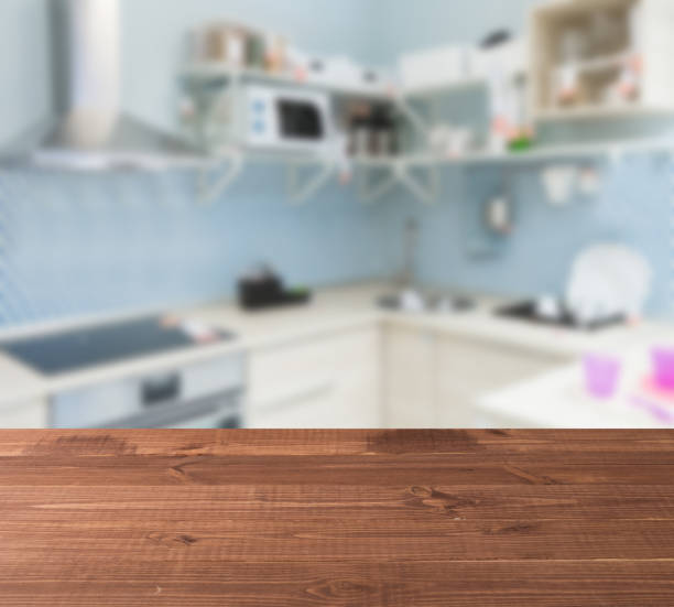 wooden table top and blur kitchen room of the background - domestic kitchen kitchen sink contemporary counter top imagens e fotografias de stock