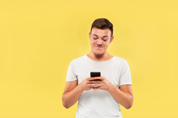 istock Caucasian young man's half-length portrait on yellow background 1178020180