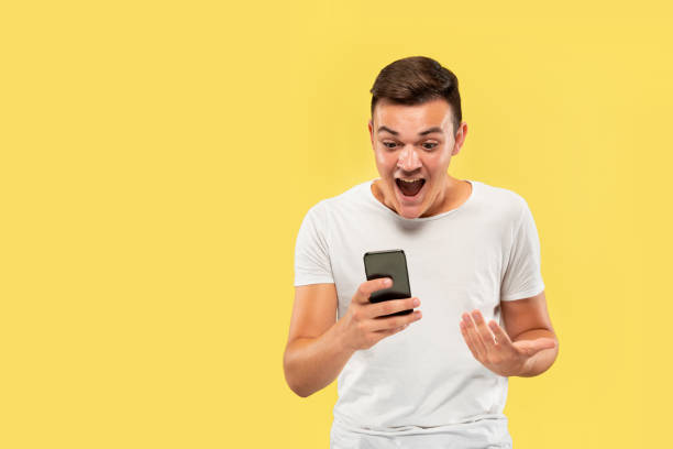 istock Caucasian young man's half-length portrait on yellow background 1178020181