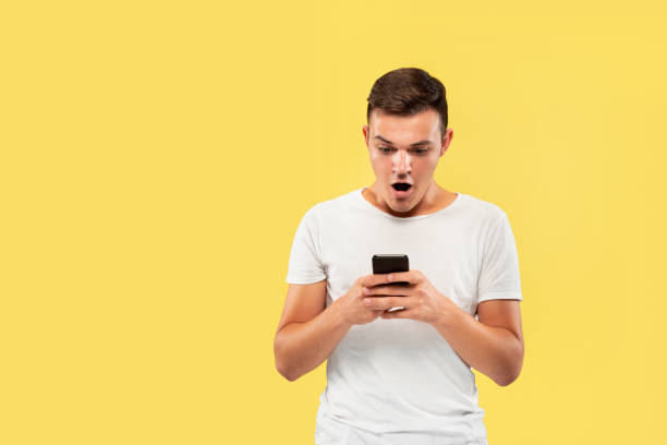 istock Caucasian young man's half-length portrait on yellow background 1178020186