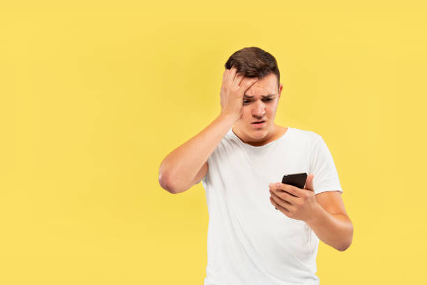 istock Caucasian young man's half-length portrait on yellow background 1178020699